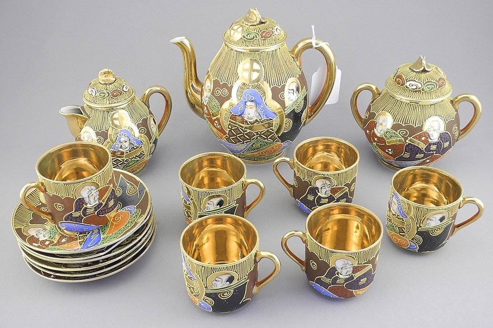 Japanese "Samurai China" Demitasse Set, 5 7/8"h (1 saucer chipped).: Japanese "Samurai China" Demitasse Set, 5 7/8"h (1 saucer chipped).