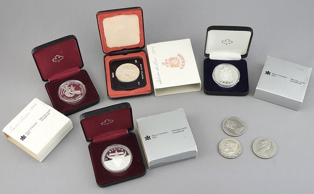 Collection of Canadian One Dollar Coins: 1971/1982/1983/1966 US Half Dollars. (1 of 4)
