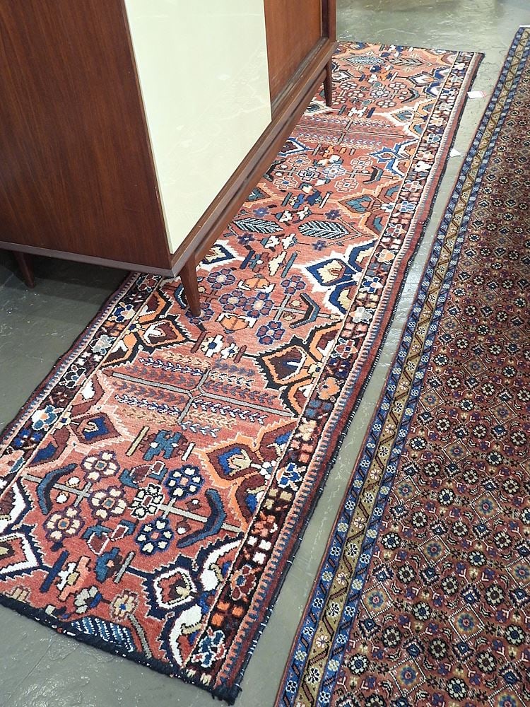 Hand Knotted Persian Runner Approximately 9'5" x 2'7". (1 of 3)