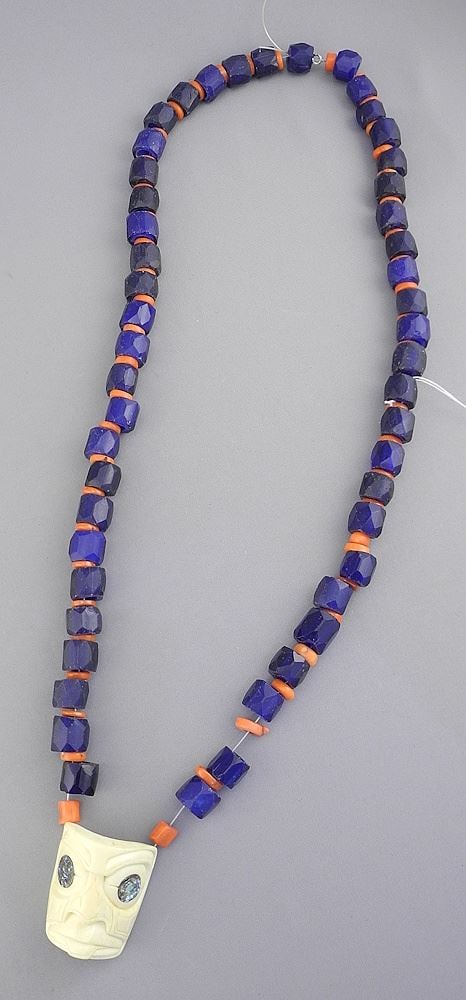 Strand of Blue Glass Trade Beads with Bone "Mask" Pendant signed S.W. Miiko, 30"L.: Strand of Blue Glass Trade Beads with Bone "Mask" Pendant signed S.W. Miiko, 30"L.