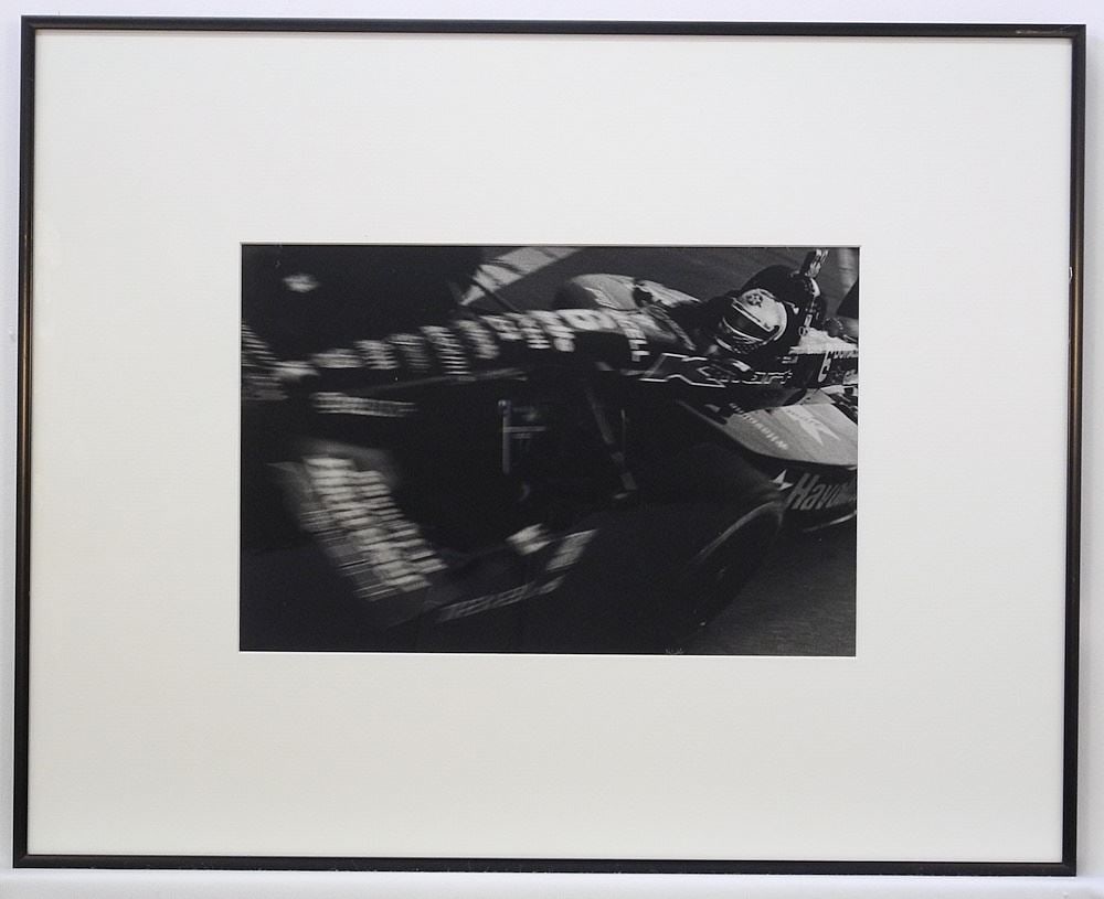 Photograph signed George Ormorean Verso, 7 3/4" x 11 3/4", "Michael Andretti Van Indy 1997. (1 of 2)