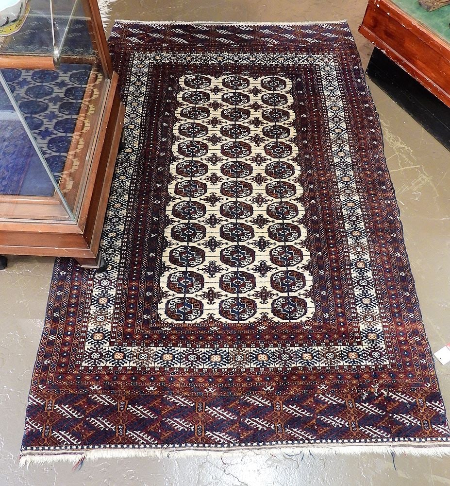 Turkmen Bokhara Carpet Approximately 3'11" x 6'3" (moth damage on one corner). (1 of 3)