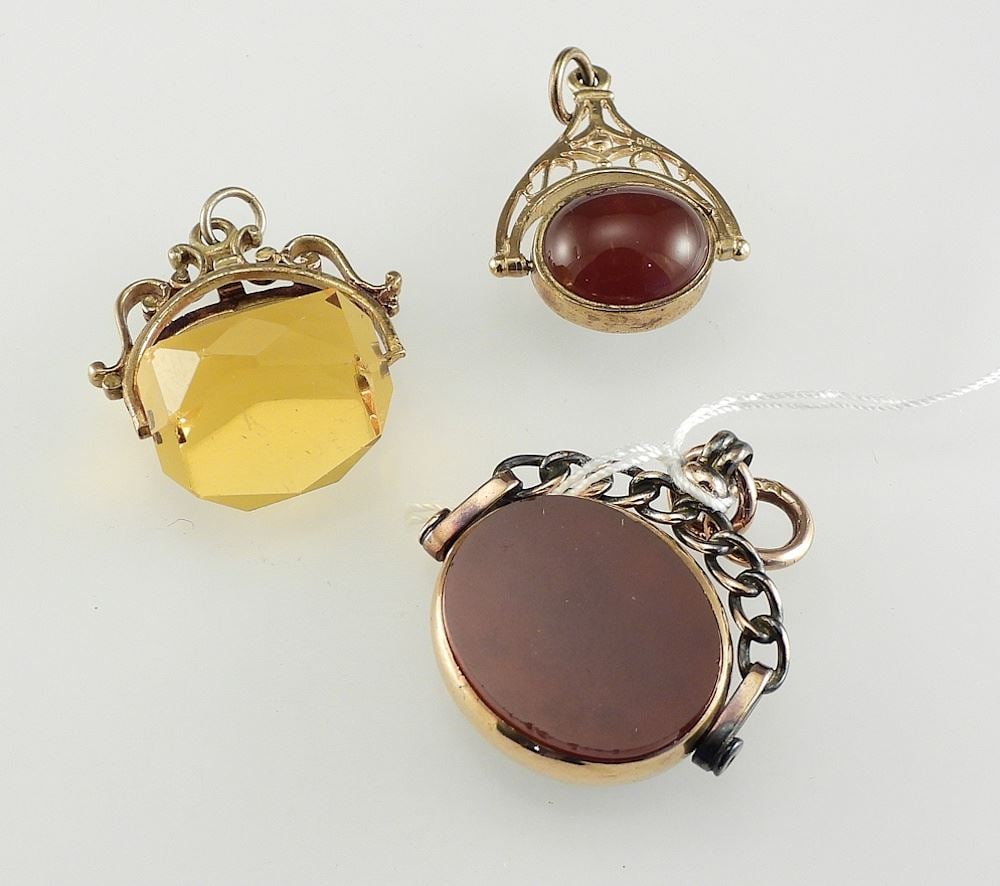 Three Antique Fobs in Gold & Gold Tone Settings, 3/4 - 1 1/8"w.: Three Antique Fobs in Gold & Gold Tone Settings, 3/4 - 1 1/8"w.