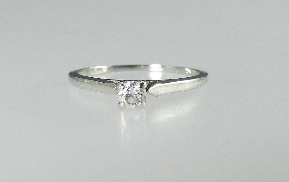 18Kt (marked) White Gold Diamond Solitaire Ring, Size 5 1/2, 1.5g.: 18Kt (marked) White Gold Diamond Solitaire Ring, Size 5 1/2, 1.5g.