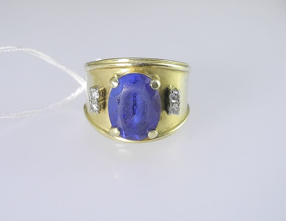 18K (marked) Gold Tanzanite (4.5CT) & Diamond Band, Size 6 3/4, 13.1g.: 18K (marked) Gold Tanzanite (4.5CT) & Diamond Band, Size 6 3/4, 13.1g.