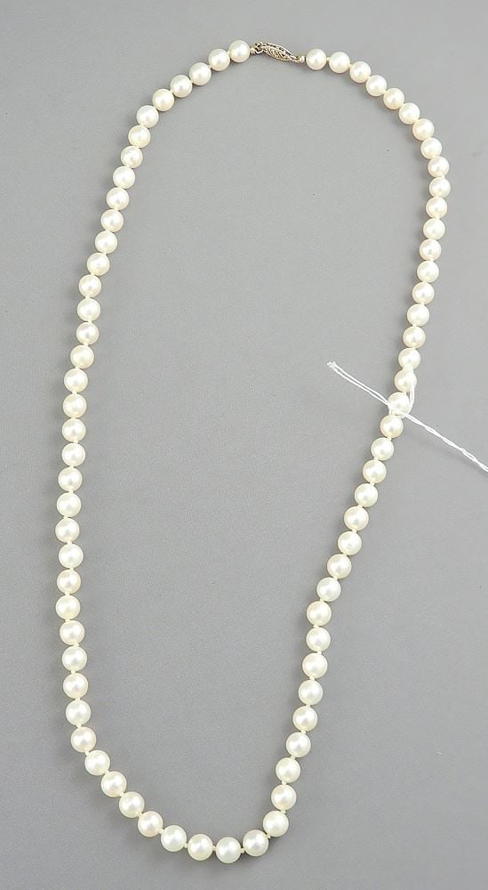 Strand of 22" Cultured Pearl Necklace with 14K Clasp.: Strand of 22" Cultured Pearl Necklace with 14K Clasp.