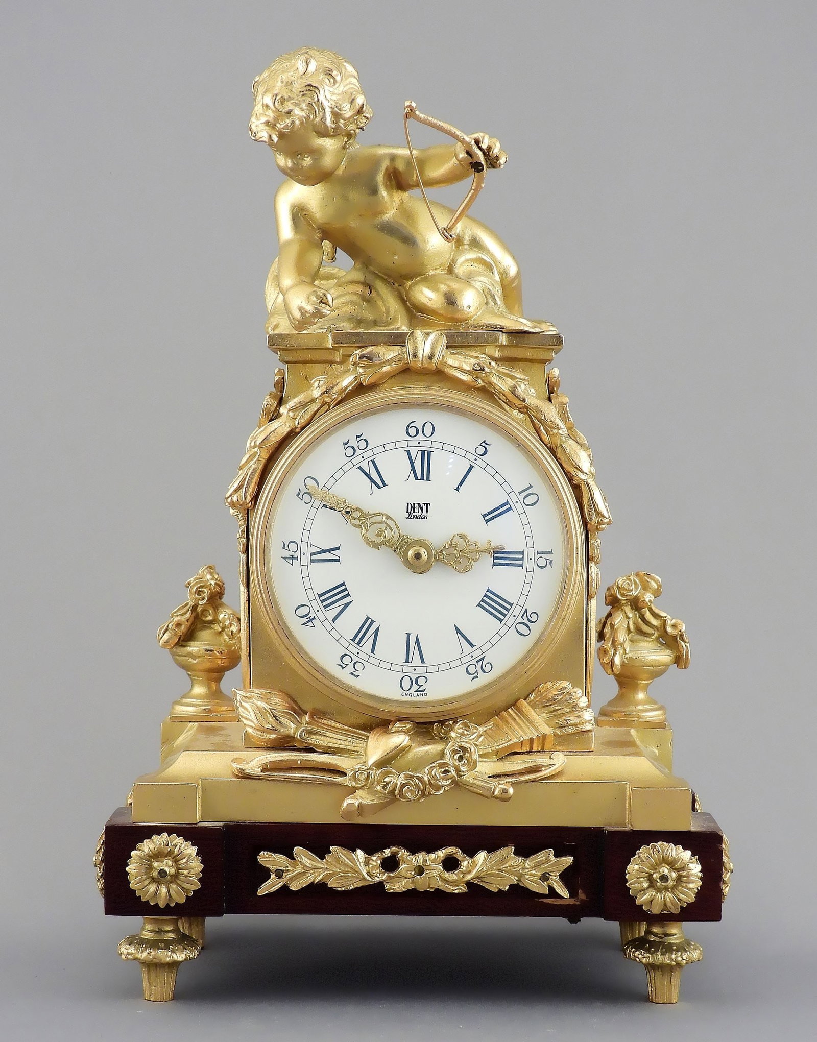 Dent Gilt Metal Putti Mantle Clock, 9"h.: Dent Gilt Metal Putti Mantle Clock, 9"h.