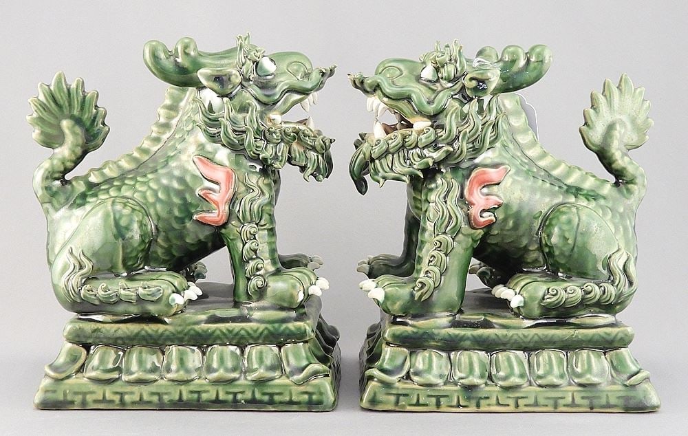 Pair of Shiwan Ware Buddhist Lion Dogs w/Seal, 7 3/8 x 4 5/8 x 6 1/4" (each missing 1 talon).: Pair of Shiwan Ware Buddhist Lion Dogs w/Seal, 7 3/8 x 4 5/8 x 6 1/4" (each missing 1 talon).