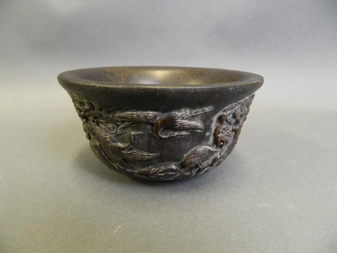 A Chinese carved wood bowl decorated with cranes (1 of 4)