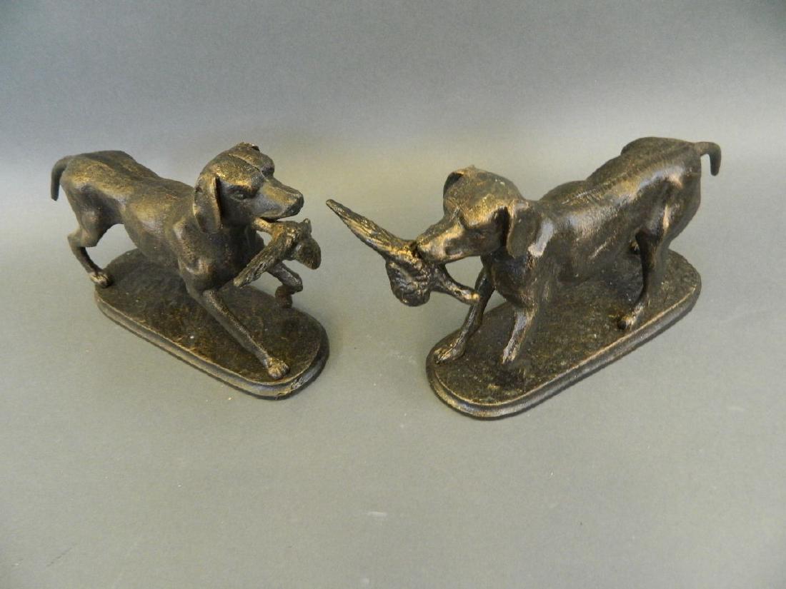 A pair of cast metal doorstops of gundogs with caught: A pair of cast metal doorstops of gundogs with caught pheasant, 6" high