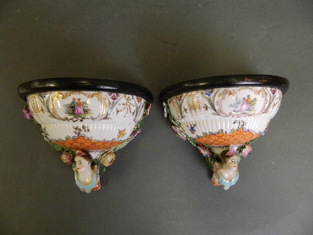 A pair of C19th Continental porcelain wall brackets, (1 of 3)