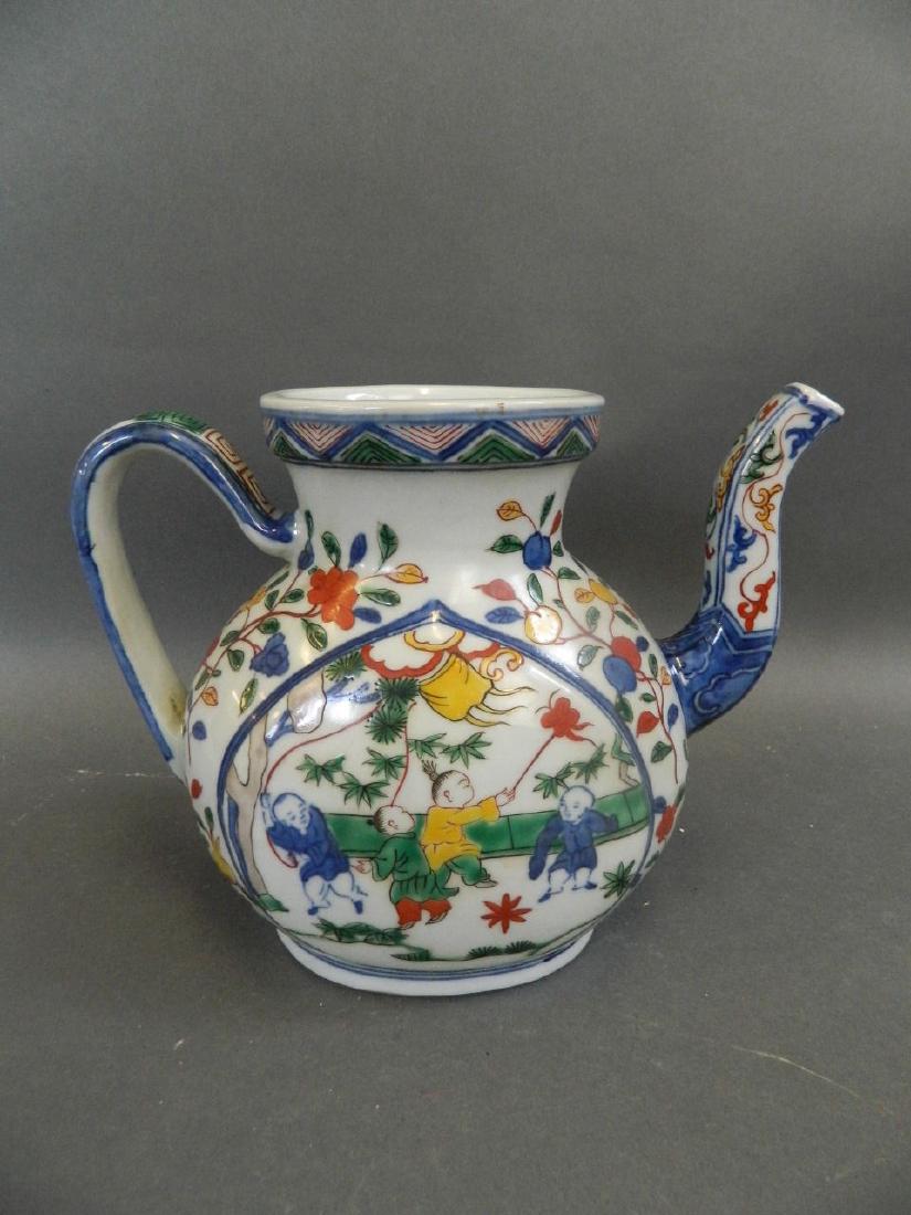 A Chinese Wucai enamel porcelain teapot decorated with (1 of 3)