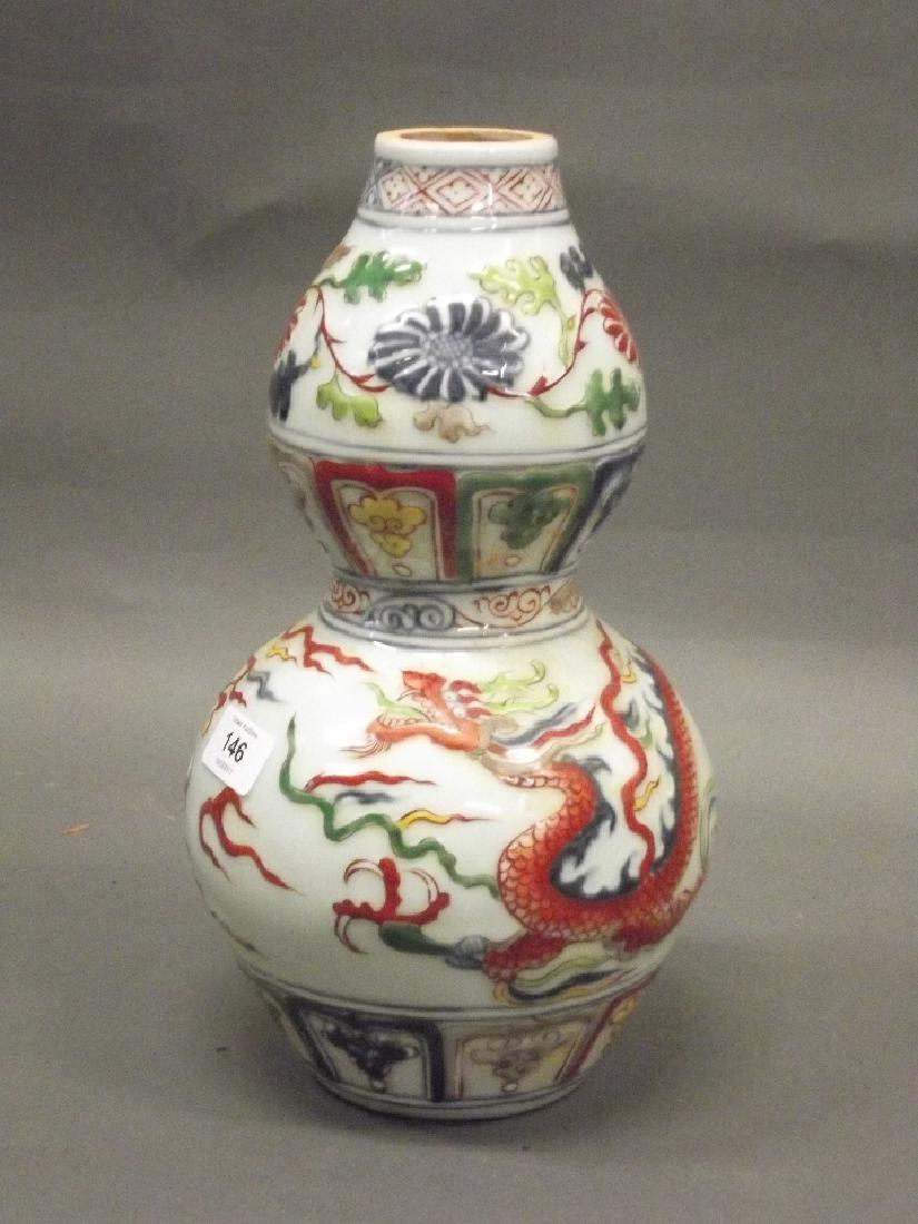 A Chinese earthenware dragon vase with raised enamel (1 of 5)