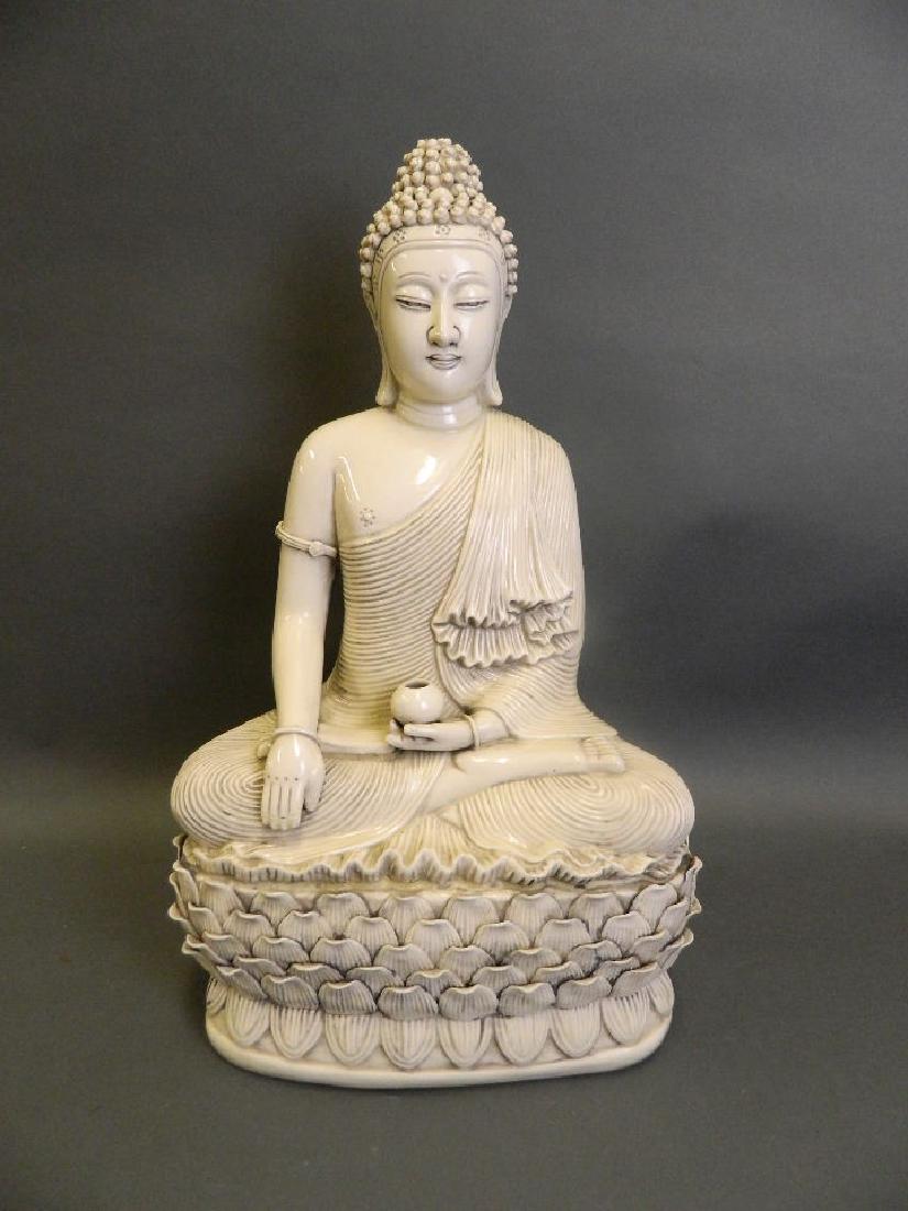 A large Chinese Blanc de Chine porcelain figure of (1 of 4)