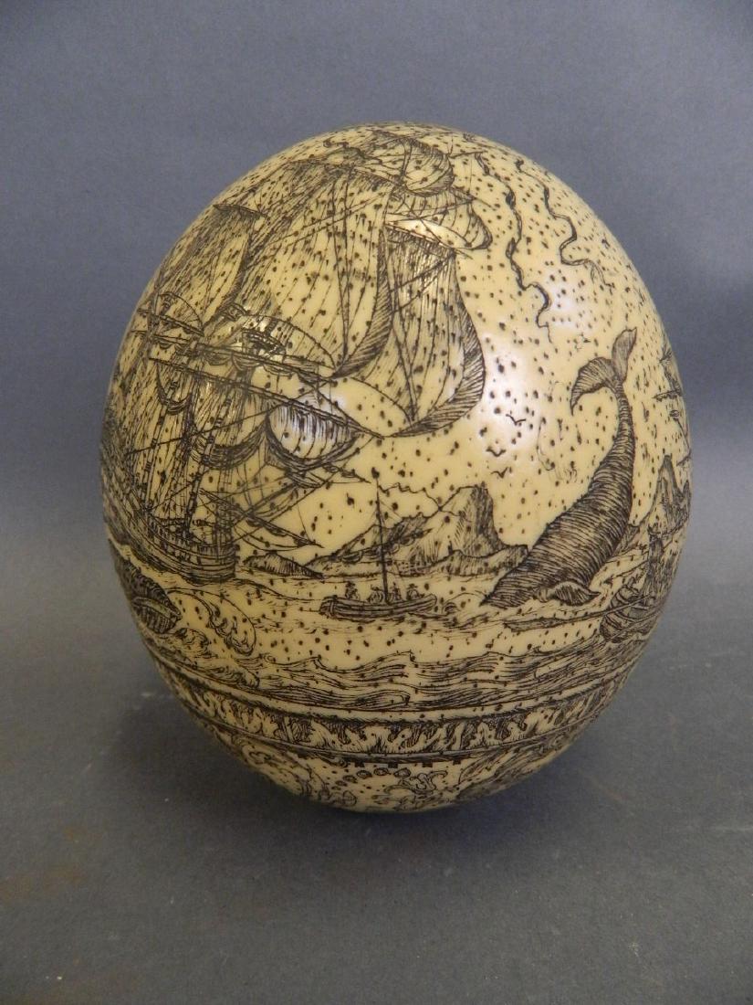 A large Scrimshaw carved egg depicting whaling scenes,: A large Scrimshaw carved egg depicting whaling scenes, 5½" high