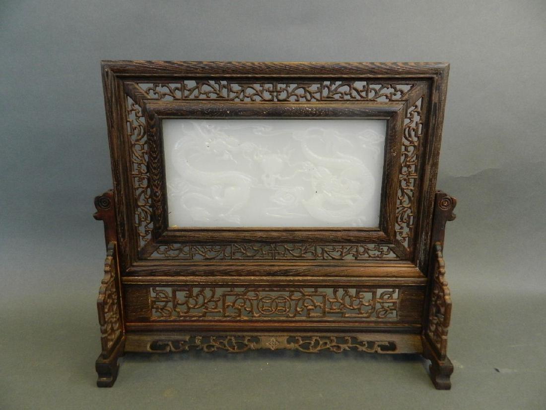 A Chinese white jade and hardwood table screen with (1 of 2)