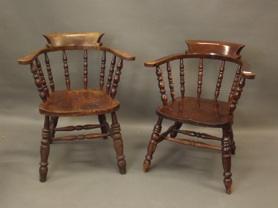 A near pair of C19th smoker's bow elbow chair with: A near pair of C19th smoker's bow elbow chair with shaped elm seats