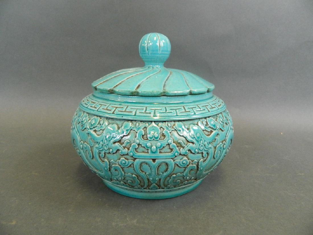 A Chinese terracotta glazed pot and cover with relief (1 of 3)
