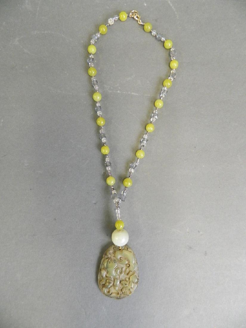 A Chinese hardstone pendant necklace with carved gourd (1 of 2)