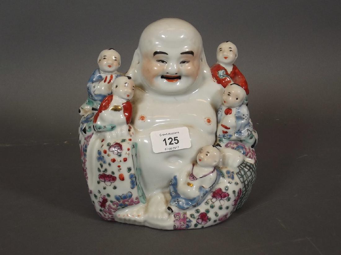 A Chinese porcelain figure of Buddha and five boys, 7½" (1 of 1)