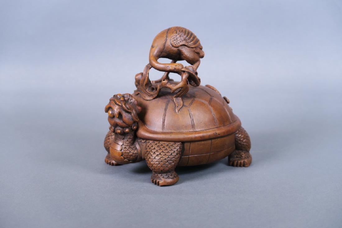 A Chinese carved bamboo censer and lid in the form of a (1 of 4)