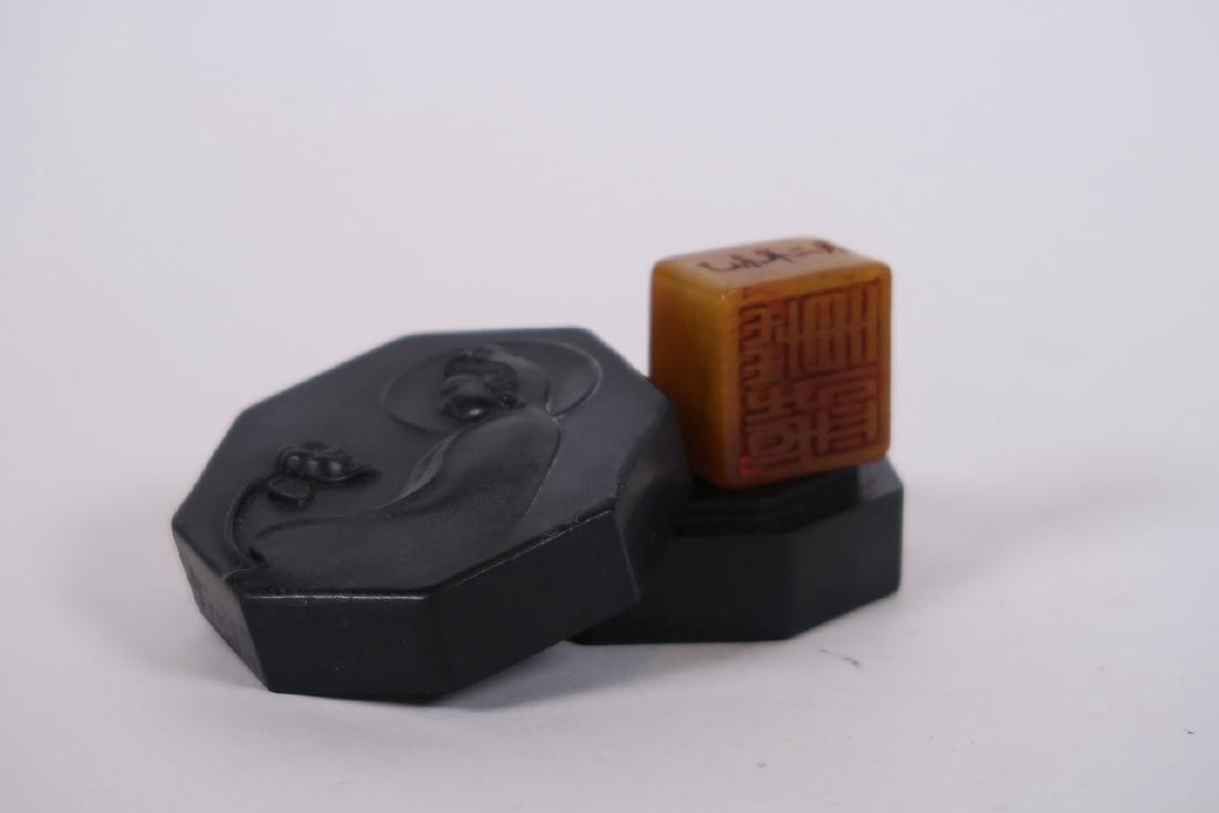 A Chinese black hardstone octagonal box and cover with (1 of 4)