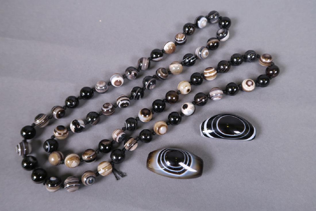 A string of banded agate eye beads, together with two (1 of 1)