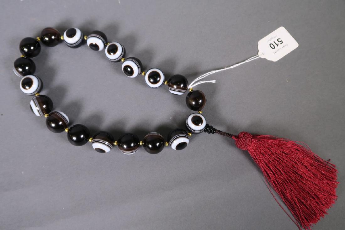 A string of banded agate eye beads, 17" (1 of 2)