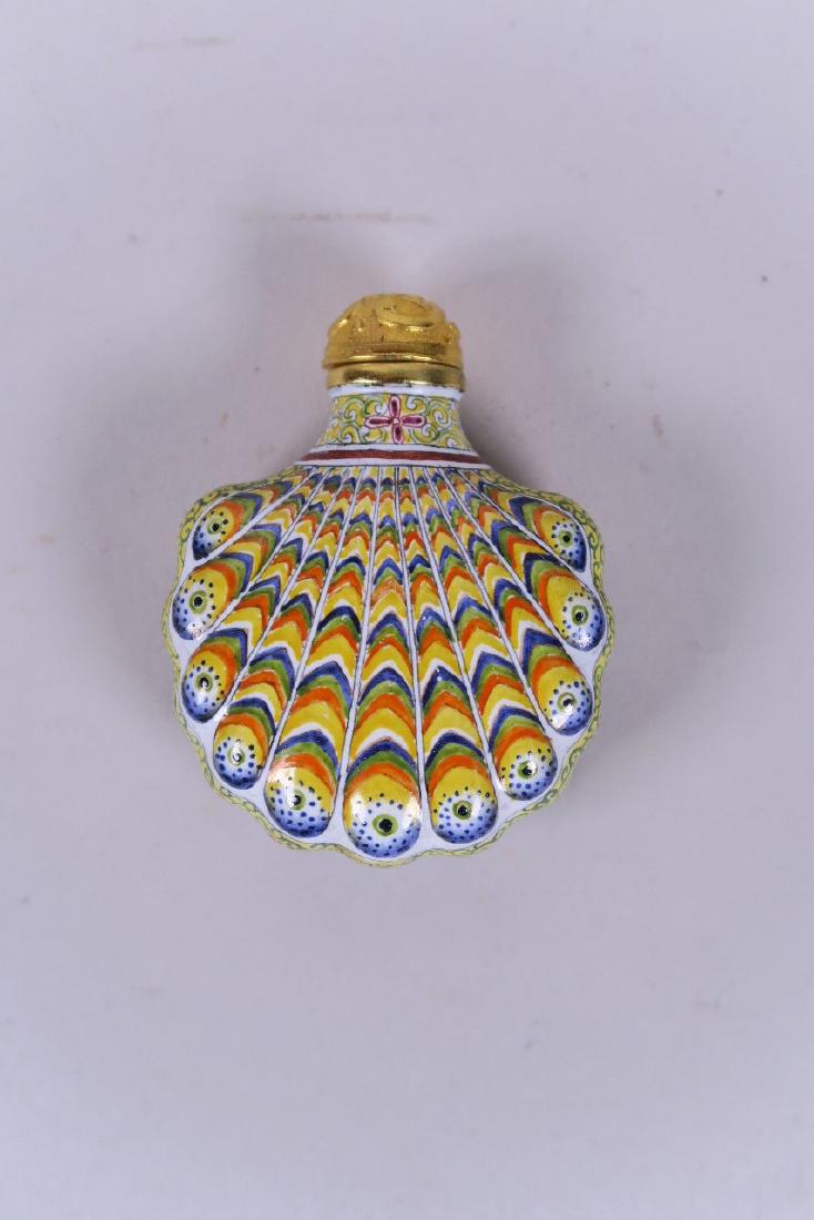 A Chinese enamel snuff bottle with peacock feather (1 of 2)