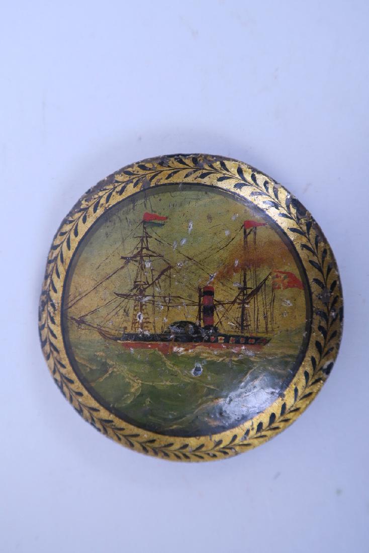 A cast iron long case clock, the pendulum weight (1 of 1)