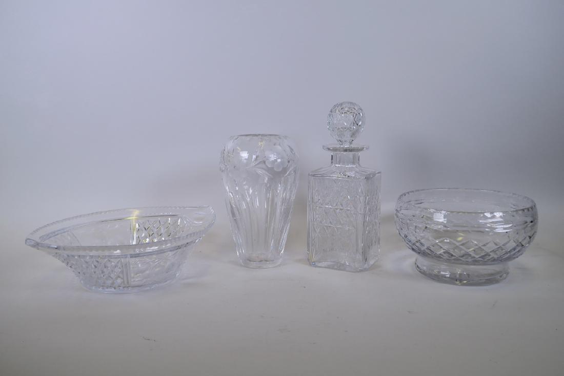 A Thomas Webb cut glass decanter, a cut glass vase with: A Thomas Webb cut glass decanter, a cut glass vase with foliate decoration, and two cut glass fruit bowls, decanter 10" high