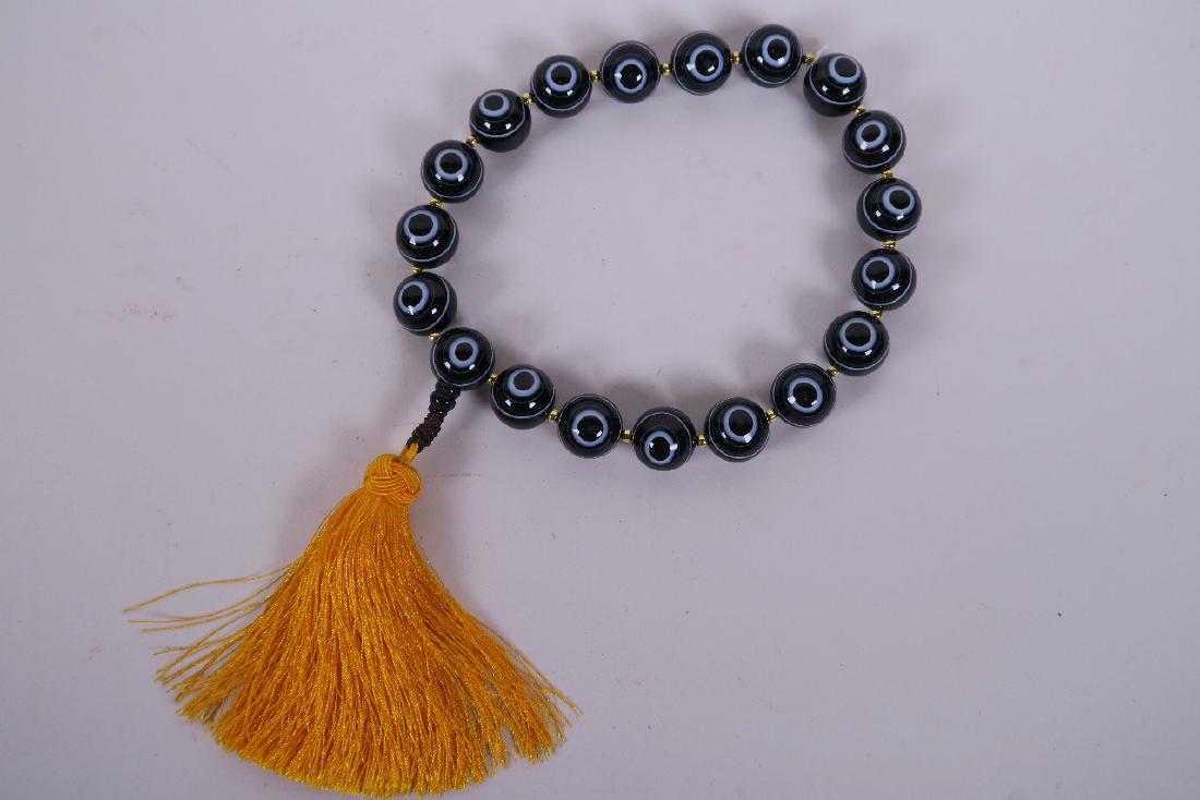 A string of black banded agate eye beads, 16" long (1 of 2)