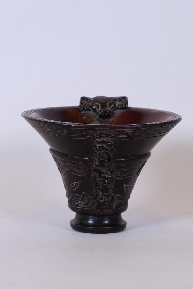 A Chinese carved horn libation cup with kylin and bat (1 of 3)