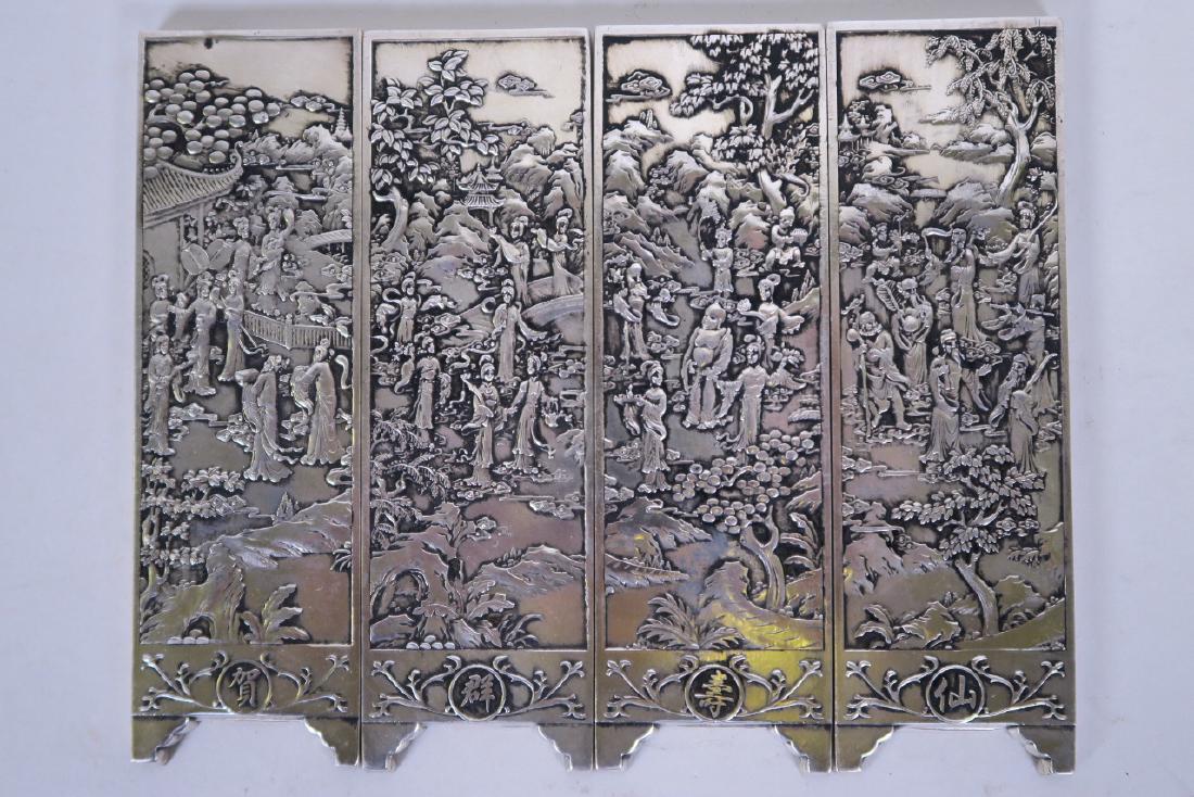 A set of four Chinese white metal scroll weights in the (1 of 1)