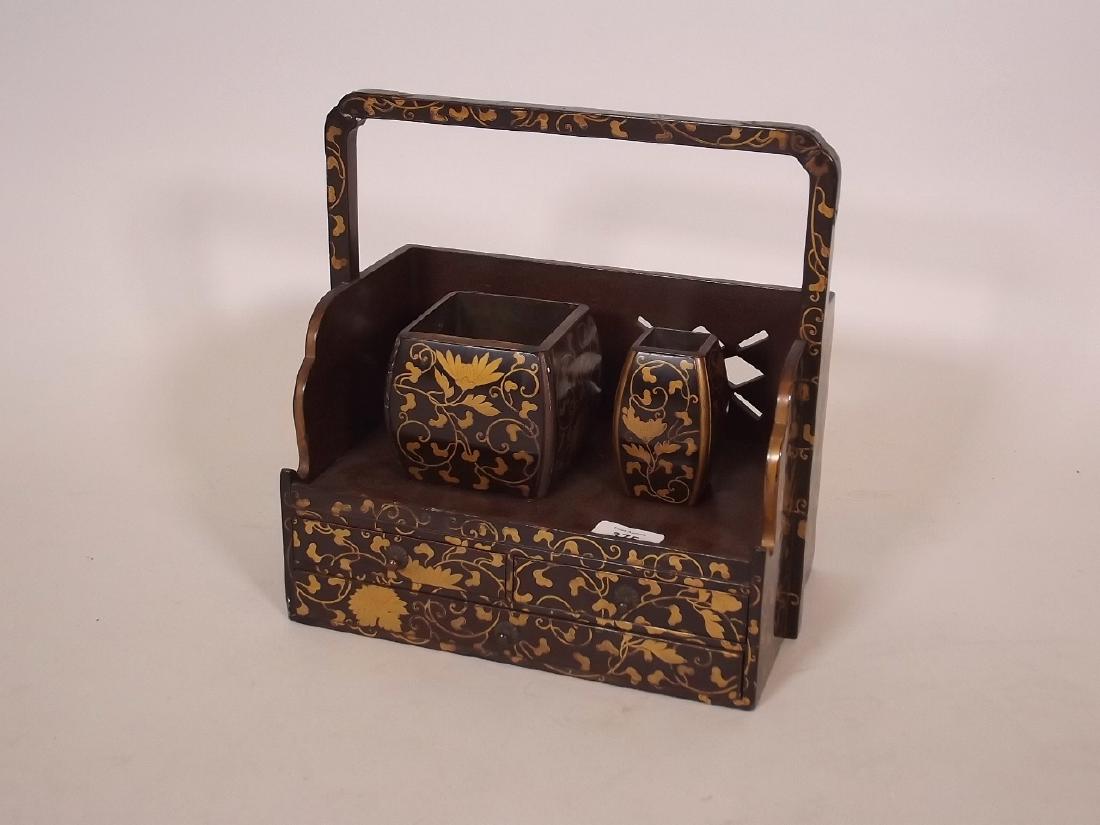 A Meiji lacquer work box with gilt decoration and (1 of 2)