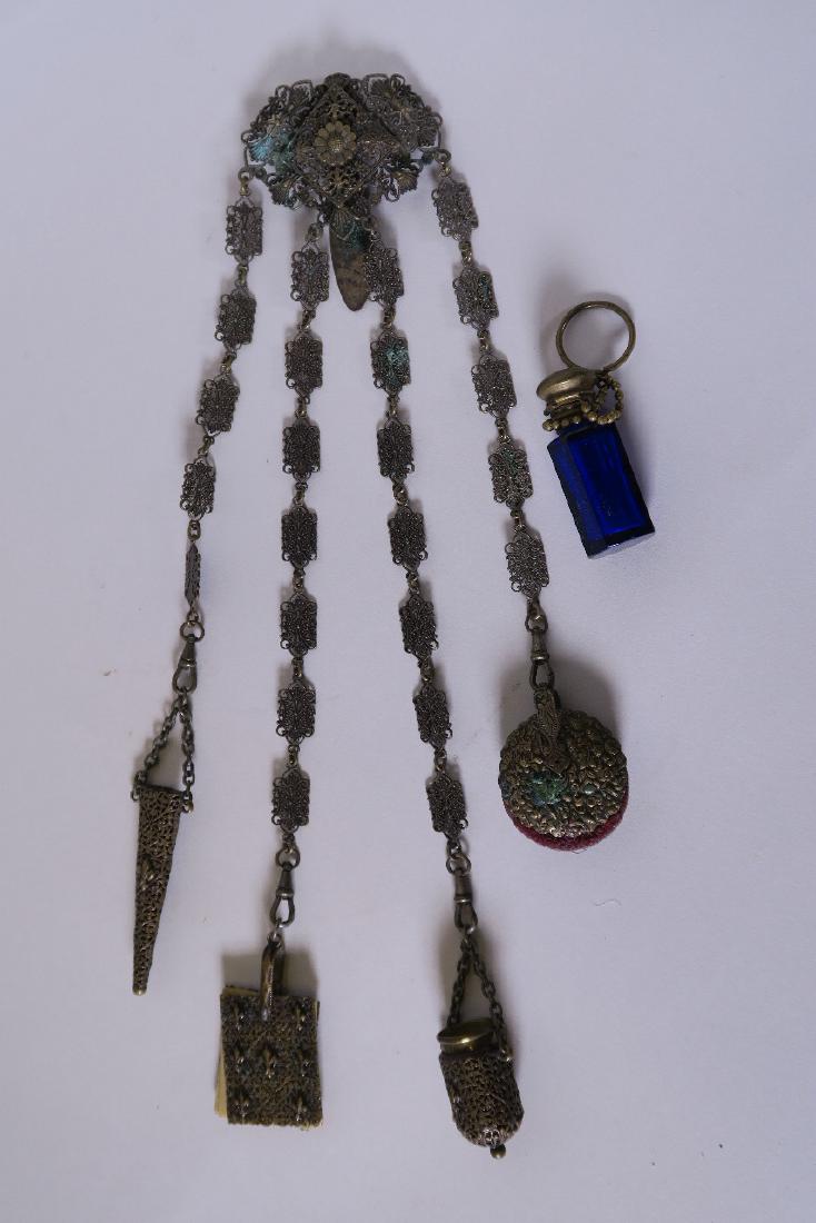 A C19th filigree chatelaine with thimble, scissor case, (1 of 3)