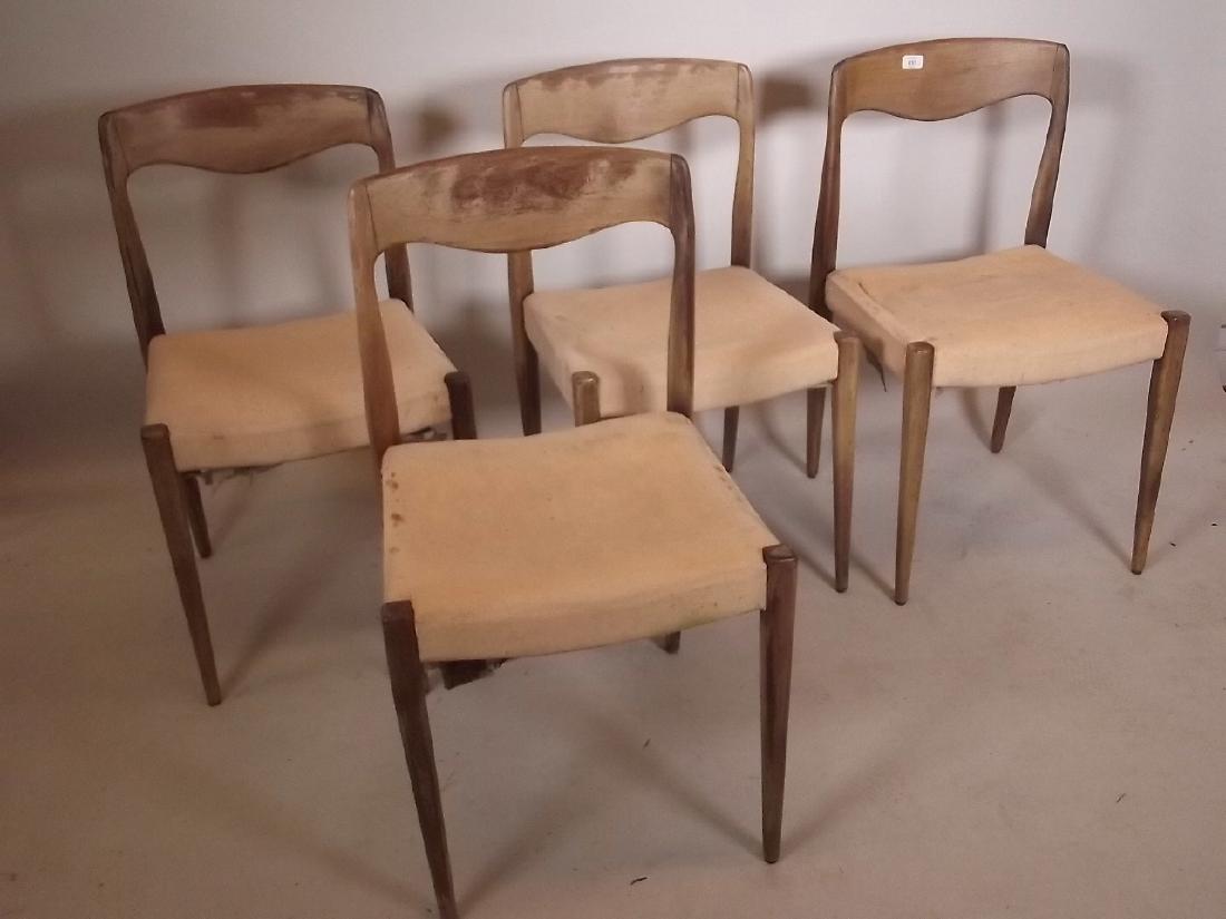 A set of four Moller style teak dining chairs on turned: A set of four Moller style teak dining chairs on turned supports, seats 18½"