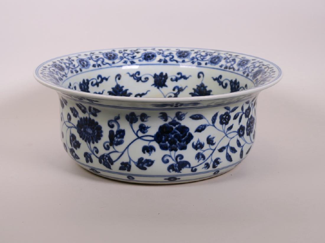 A large Chinese blue and white porcelain pot decorated: A large Chinese blue and white porcelain pot decorated with the eight Buddhist symbols and lotus flowers, 12½" diameter