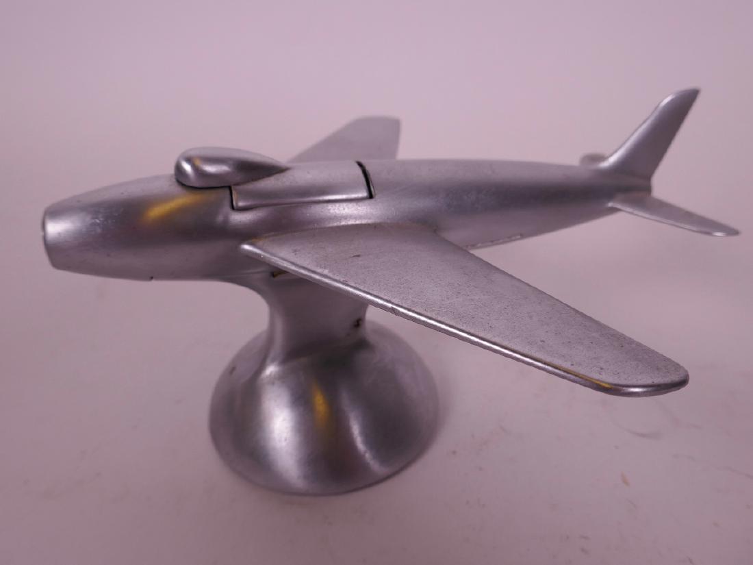 A Dunhill table lighter modelled as a swept wing jet: A Dunhill table lighter modelled as a swept wing jet fighter aircraft, 6" long
