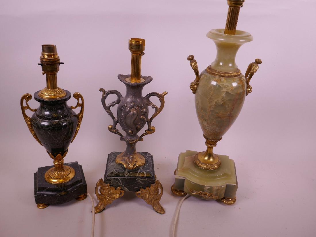 A marble and ormolu urn pattern table lamp, 13" high,: A marble and ormolu urn pattern table lamp, 13" high, together with a gilded pewter table lamp on marble socle and ornate metal feet, and an onyx and gilt metal classical style table lamp