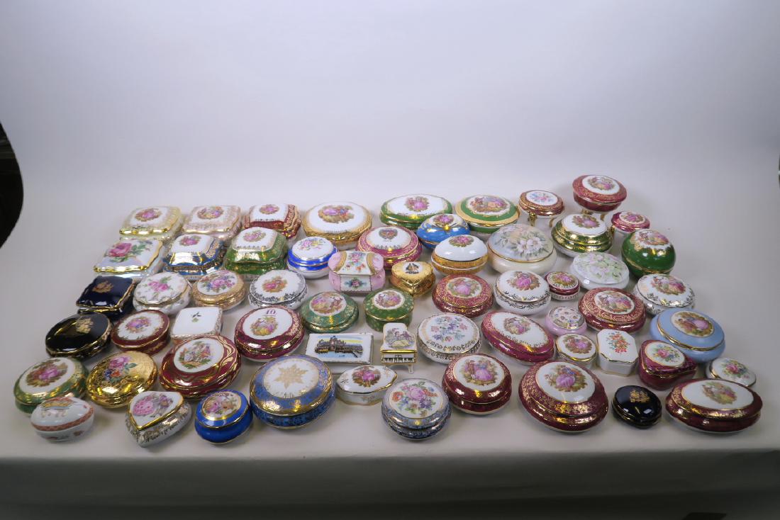 A large collection of Limoges porcelain trinket boxes,: A large collection of Limoges porcelain trinket boxes, largest 4 1/2" diameter