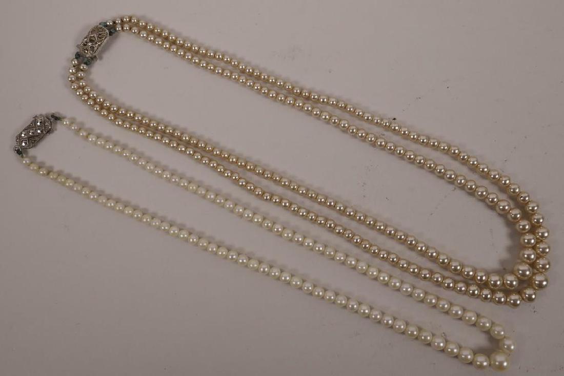 A two string graduated pearl necklace with sterling: A two string graduated pearl necklace with sterling silver clasp, 17" long, together with a single string graduated pearl necklace with silver and marcasite clasp, 17" long