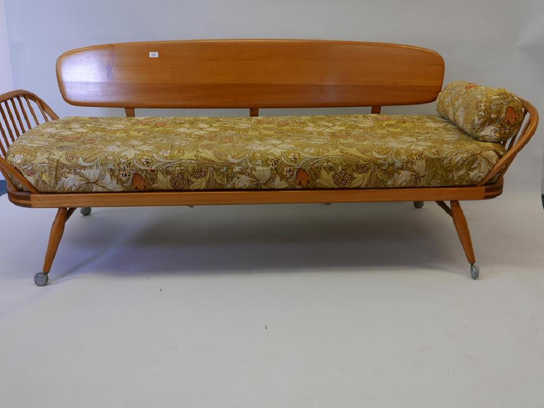 A mid C20th Ercol beechwood day bed, 81" x 29" x 32": A mid C20th Ercol beechwood day bed, 81" x 29" x 32"