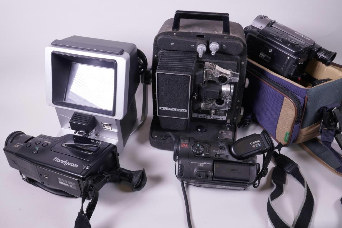 Two Sony Handycam 8mm video recorders, together with a: Two Sony Handycam 8mm video recorders, together with a Canon UC-XI Hi8 camcorder, a Bell and Howell 256 EX 8mm projector and an Elmo 912 Editor dual type, with various cases and accessories
