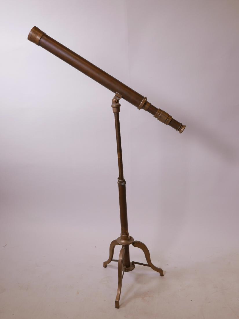 A brass telescope and stand, 27" long: A brass telescope and stand, 27" long