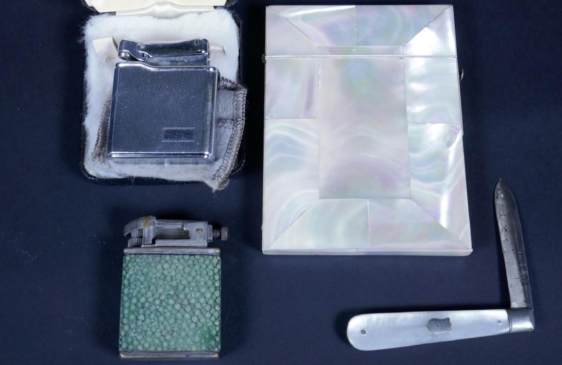 A mother of pearl card case, 4" x 3", together with a: A mother of pearl card case, 4" x 3", together with a mother of pearl handled silver fruit knife and two cigarette lighters, Calibri and Ronson