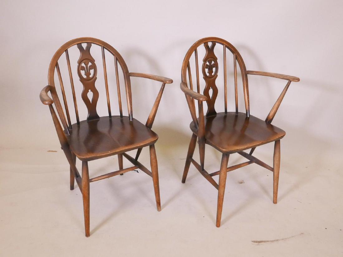 A pair of Ercol hoop back elbow chairs: A pair of Ercol hoop back elbow chairs
