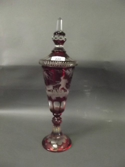A large Bohemian ruby etched glass vase and cover