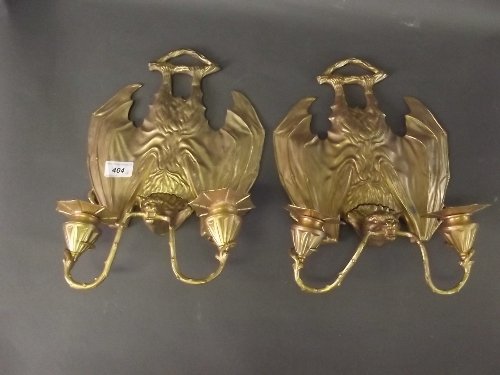 A pair of gilt brass 2 branch wall lights in the form: A pair of gilt brass 2 branch wall lights in the form of bats, 13½'' high