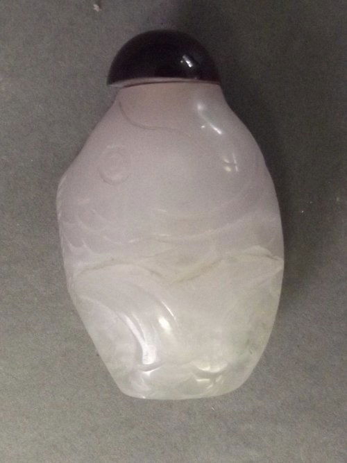 A Chinese glass snuff bottle molded in the form of a fi: A Chinese glass snuff bottle molded in the form of a fish, 2½'' long